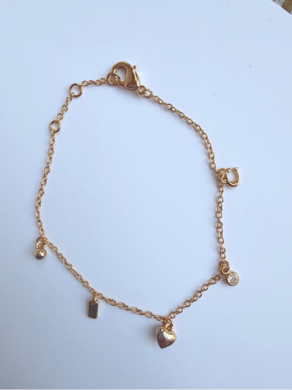 COACH Gold Heart Charm Bracelet with Dainty Charms